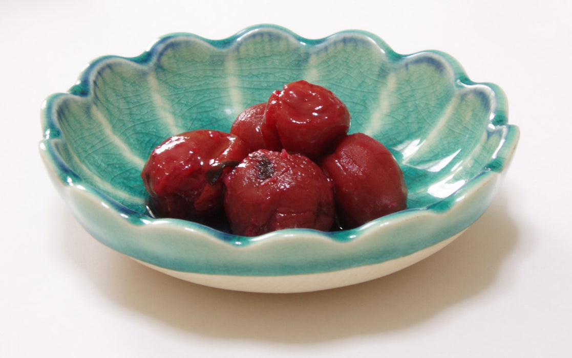 red umeboshi in a small blue bowl