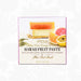 A square product box for POG Hawaii Fruit Paste, featuring illustrations of fruit pastries and sliced citrus on a white background with a faint floral pattern.
