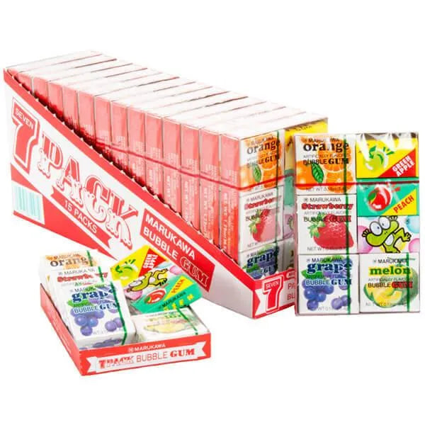 Marukawa bubble gum packages in various flavors displayed in a box on a white background