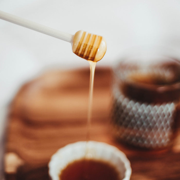 Big Island Bees Macadamia Nut Honey added to tea